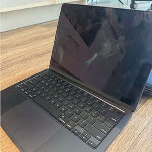 Sleek Black Laptop with Touchpad and Edge-to-Edge Display